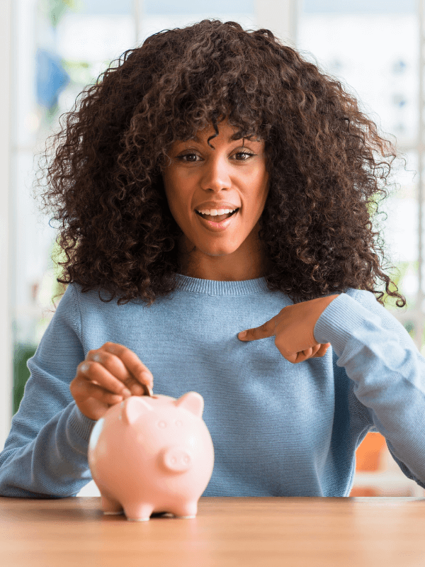 curly-haired-woman-with-a-piggy-bank