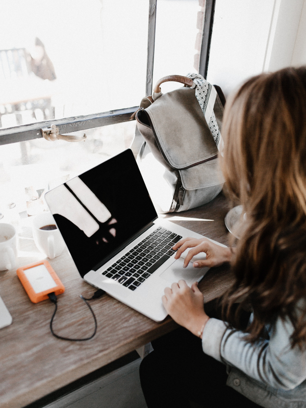 woman-typing-on-her-laptop