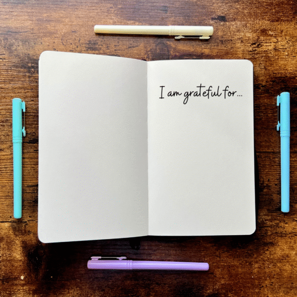 open journal with writing in it I am grateful for