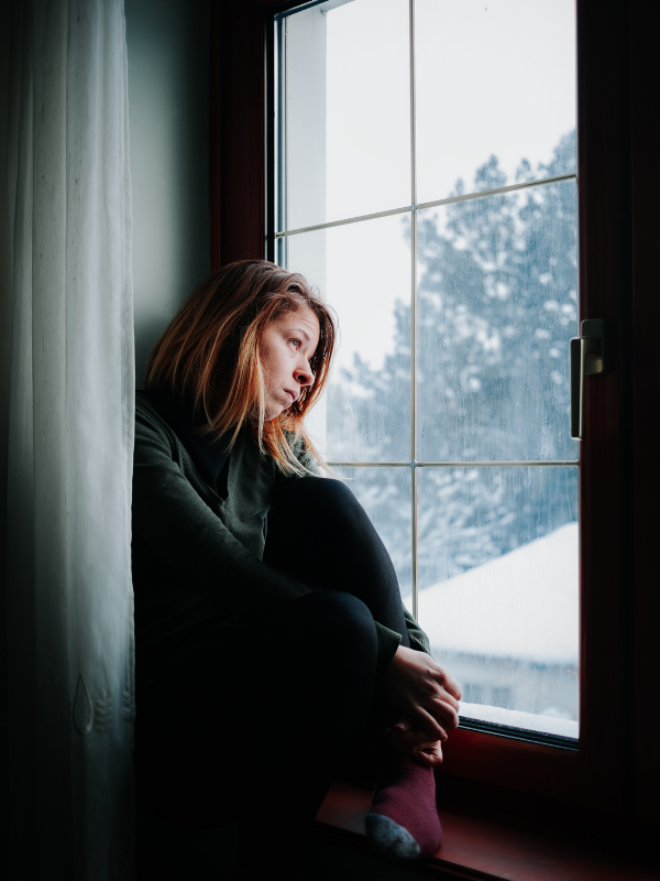 sad-woman-looking-at-the-window