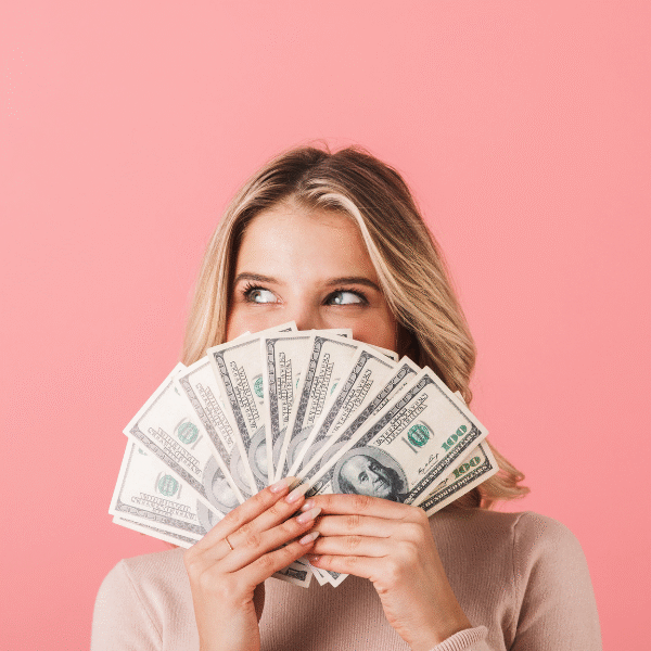 woman-smiling-behind-some-cash-money