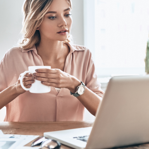 woman-wtih-coffee-working-on-computer