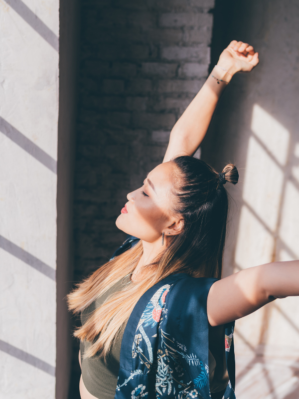 woman-stretching-at-the-window