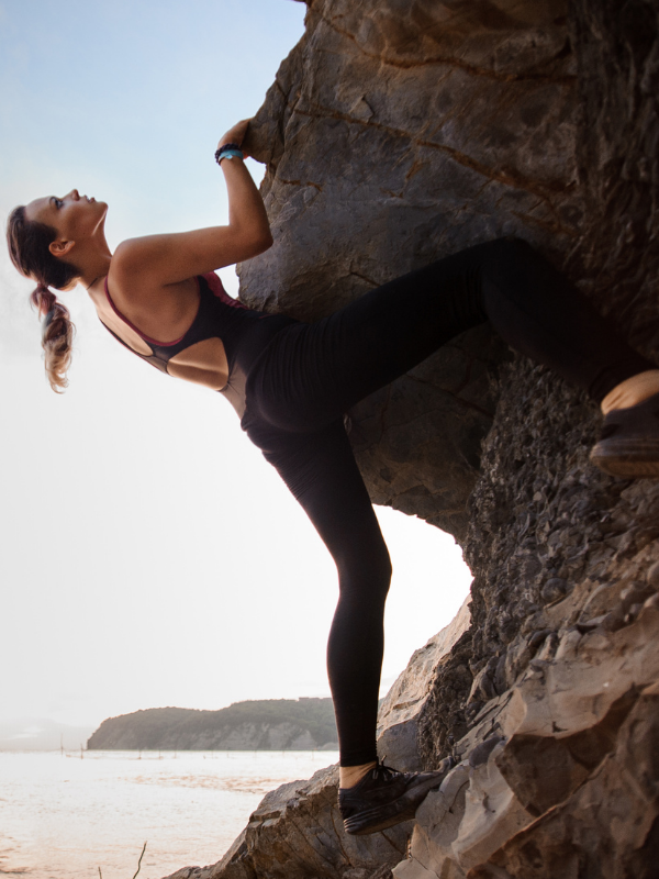 woman-climbing-on-a-cliff