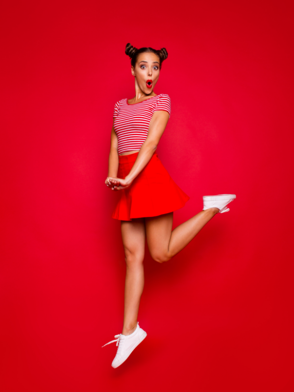 woman-in-red-jumping-joyfully
