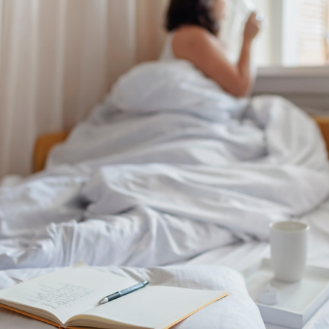 an-open-notebook-on-the-bed