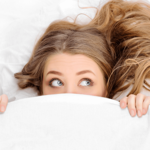 woman-under-white-bedsheets