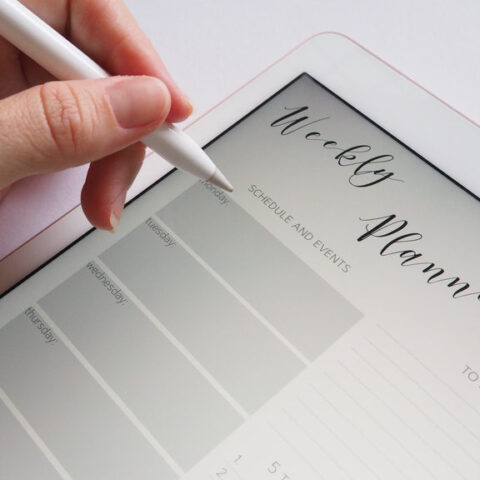 Canva-Person-Holding-White-Stylus-800x576