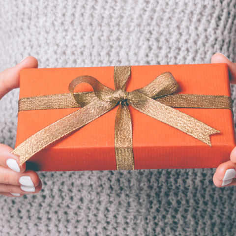 woman holding a meaningful gift