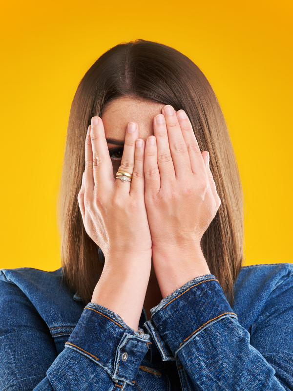 woman-hiding-herself