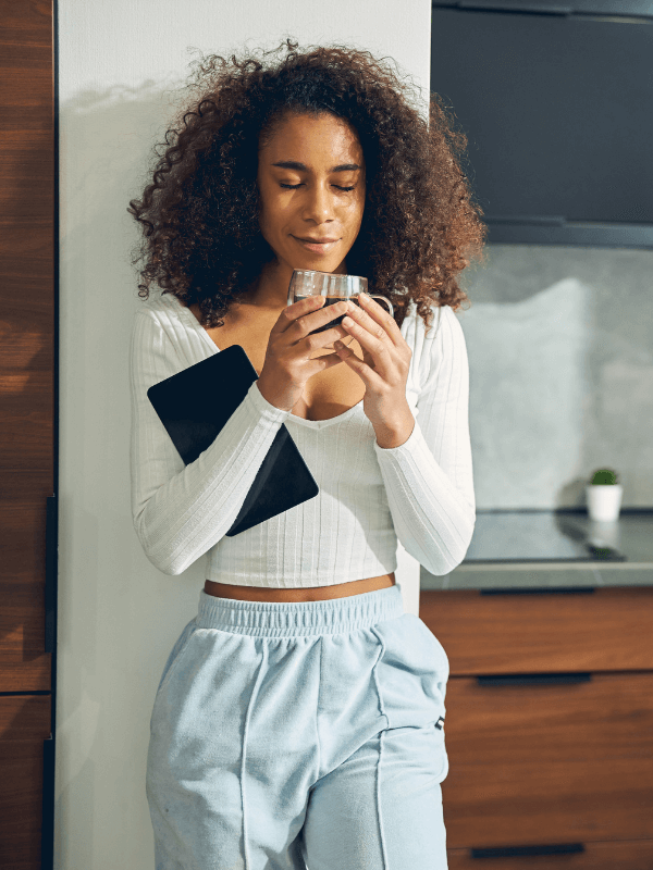 woman-enjoying-her-morning-coffee-with-eyes-closed