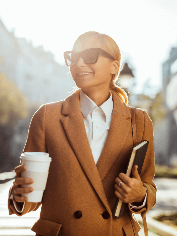 business-womna-with-coffee-in-her-hand