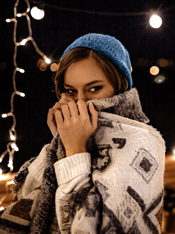 woman-being-shy-covered-in-a-blanket