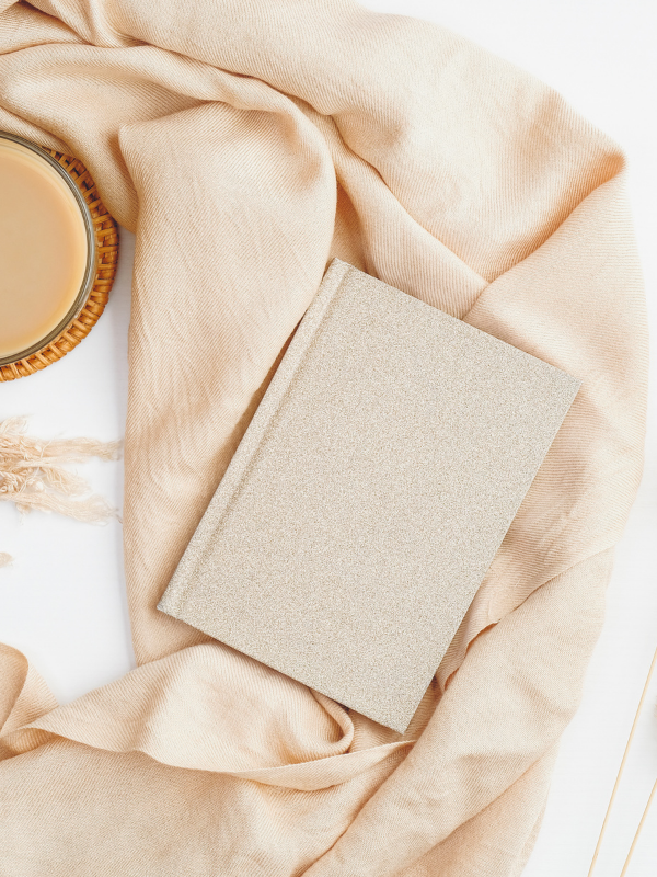 journal and cup of coffee