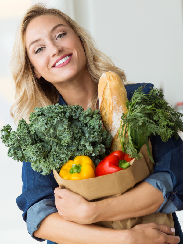 woman holding a grocery shopping bag