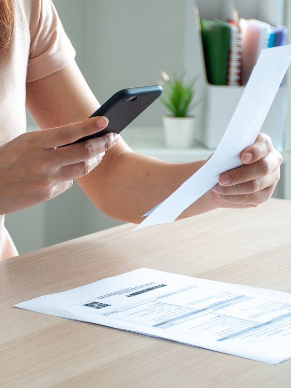woman scanning her bill