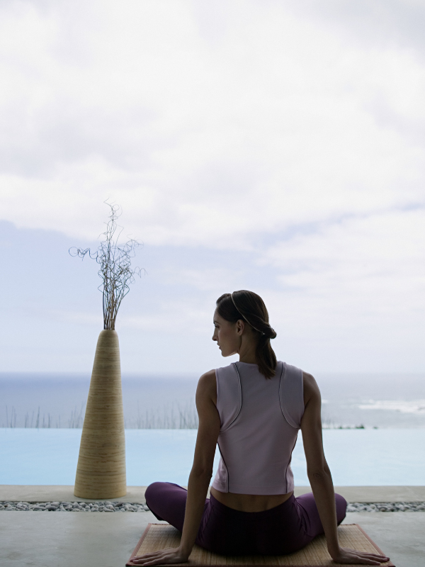 meditating woman on a mat