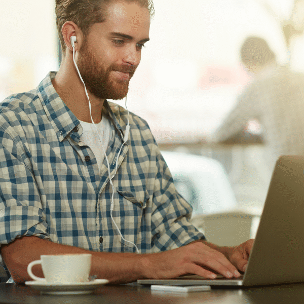 man with headphones working hard