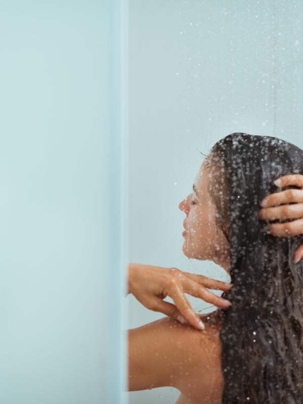 woman taking a shower in the morning