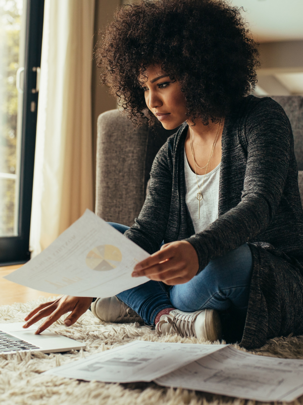 woman sitting on the floor working from home