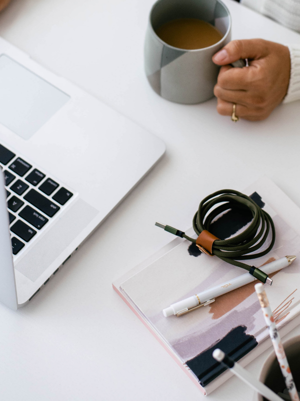 work desk, woman holding mug