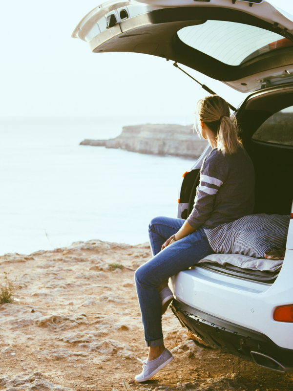 enjoying a view from the back of a van