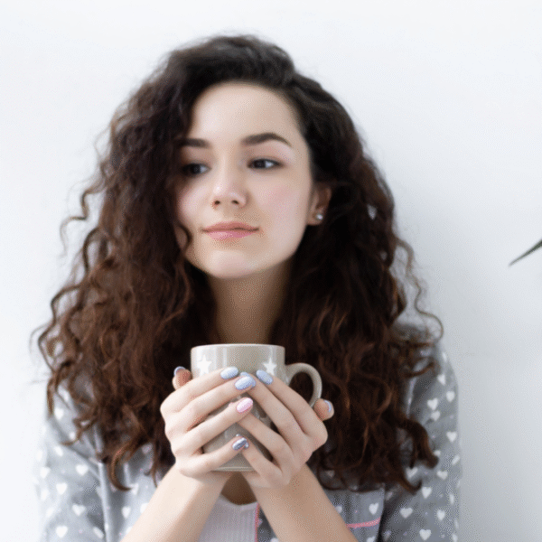 woman holding a cup of morning coffee