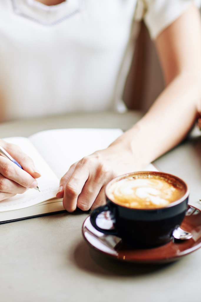 woman writing in a journal