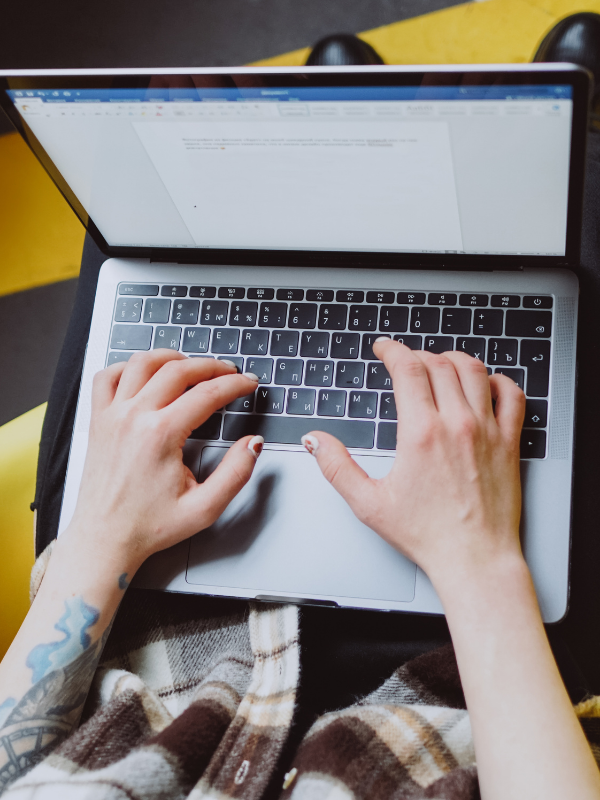 woman typing on a laptop