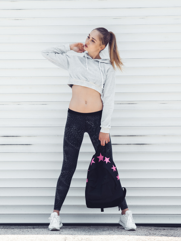 young woman in her 20s with a back pack