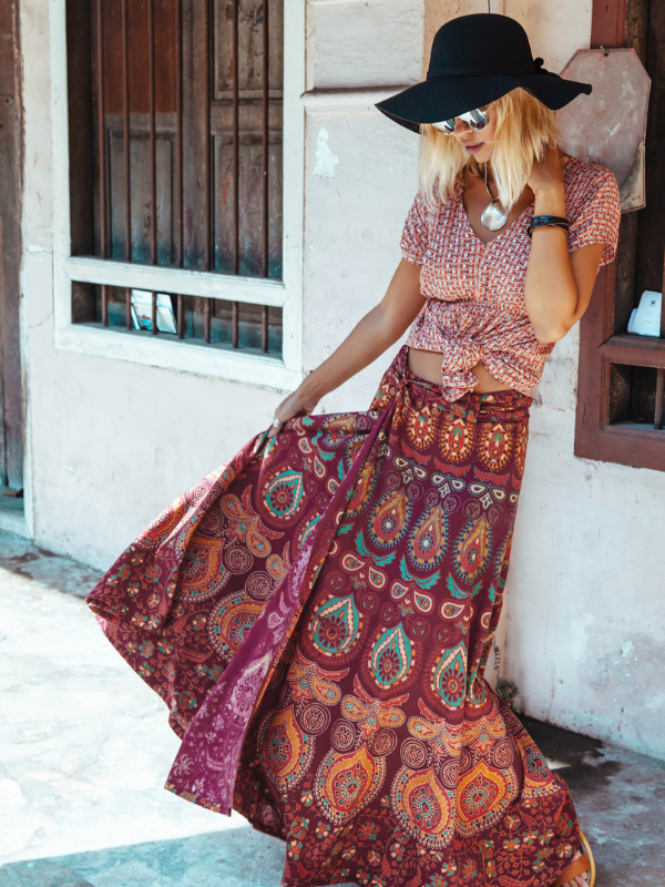 young woman with a hat and boho clothes