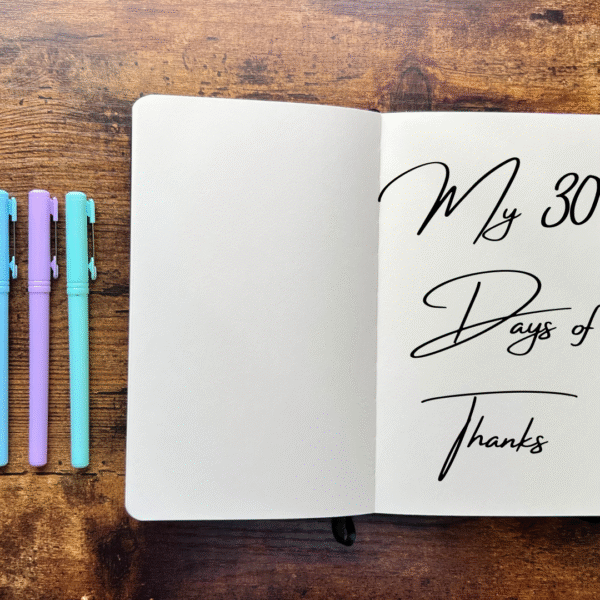 featured image for post 30-Days Gratitude Challenge of an open blank notebook with the phrase My 30 Days of Thanks written on a page with three pens on the side