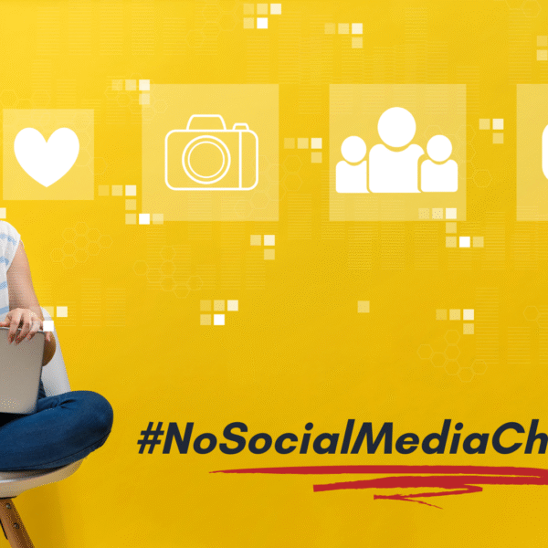 featured photo of a woman sitting on a chair and watching at social media icons, has a hashtag no social media challenge