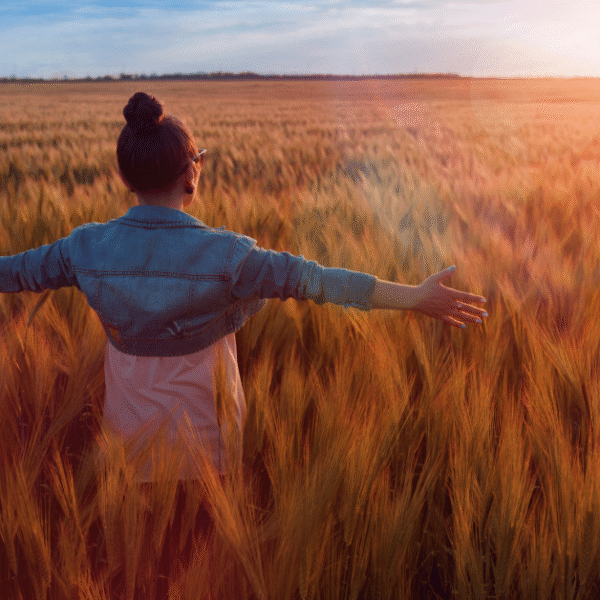 woman with open arms expressing daily gratitude affirmation in nature featured image