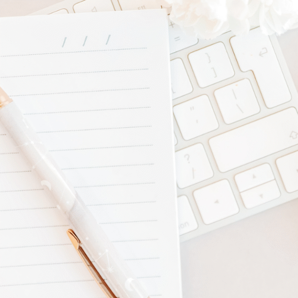 featured photo os an open notebook with pen on top of it for writing journal prompts for emotional processing