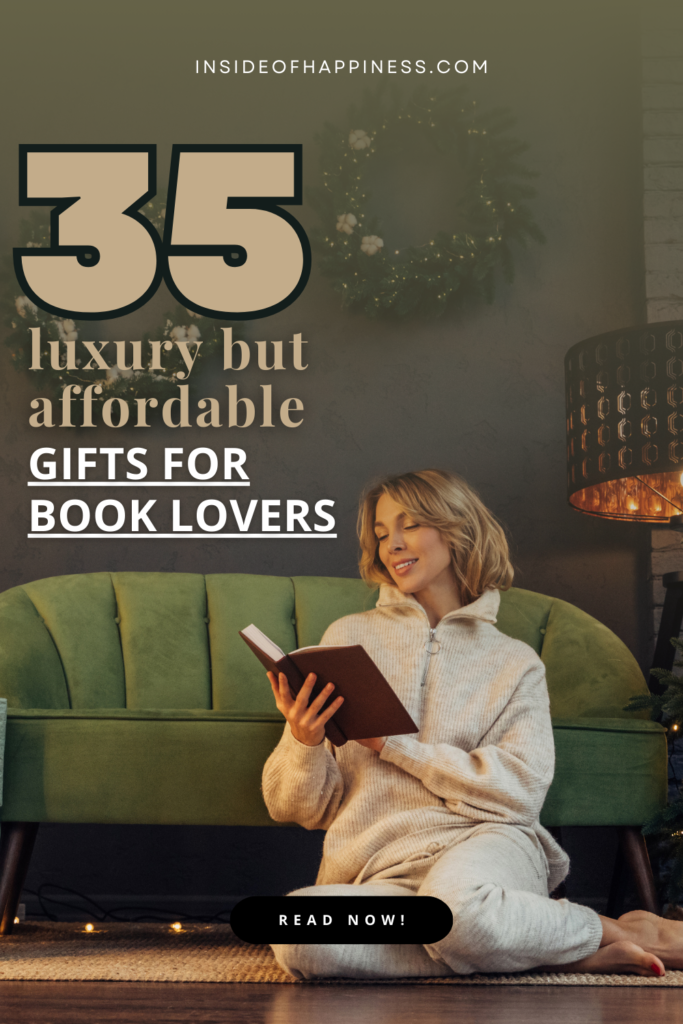 pin image of a woman sitting on the floor of her living room and reading a book, room is decorated for Christmas
