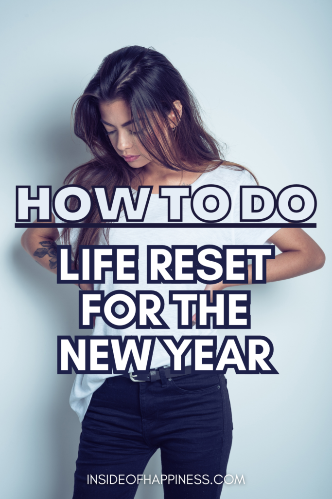 pin image of a woman with a t-shirt looking at her hair, overlay text says how to do life reset for the new year