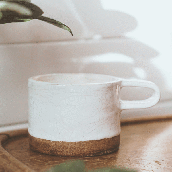 featured image for post with to-do lists one to do every month that shows an aesthetic ceramic coffee mug on a table